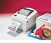 Image of a Zebra LP 2844 Printer with shipping label and box