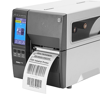 Image of a Zebra ZT231 RFID industrial printer with media